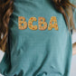 Christmas Cookie BCBA Unisex Garment-Dyed T-shirt, Behavior Analyst Shirt, Holiday Festive Tee, Gift for ABA Therapist, Funny Christmas